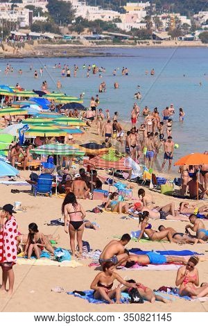 Salento, Italy - June 2, 2017: People Visit Maldives Di Pescoluse Beach In Salento Peninsula, Italy.