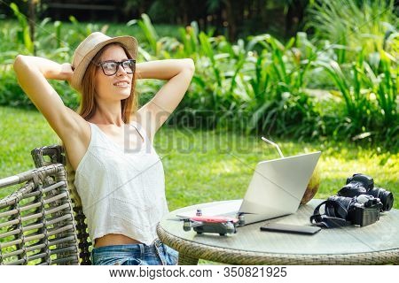 Young Photographer Woman Feeling Happy Becouse She Get Money Online While Sitting At Tropical Cafe