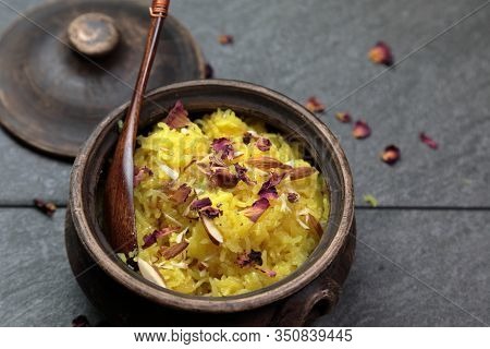 Sweet Rice Or Zarda Pulao On A Grey Background With Copy Space.