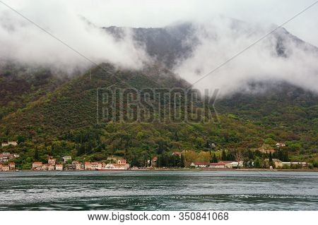 Cloudy Mediterranean Landscape On Rainy Spring Day. Clouds Formation. Village At Foot Of Mountain. M