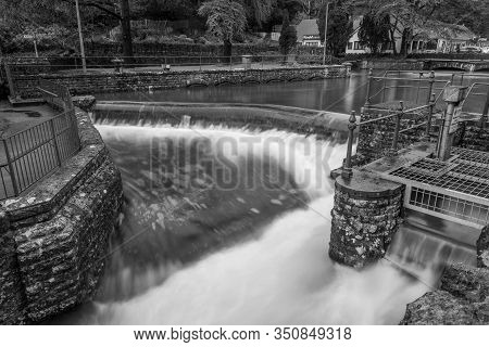 Black And White Photo Of A Waterfall In Cheddar Village In Somerset