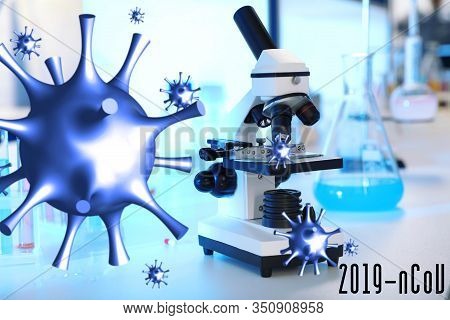Modern Microscope On Table In Laboratory. Researching Of Coronavirus