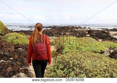 Hiking In Spring Time. Back View Of Girl Exploring The Northern Of The Island Of Lanzarote, Canary I