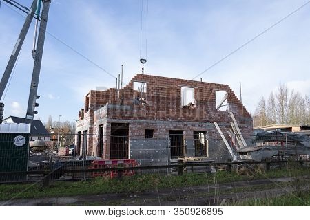 Sint Gillis Waas, Belgium, February 12, 2020. The Side Of A House Under Construction, There Is Used 
