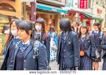 Yokohama, Japan - April 21, 2017: Group Of Asian Girls In School Uniform Wear A Mask While Walking I