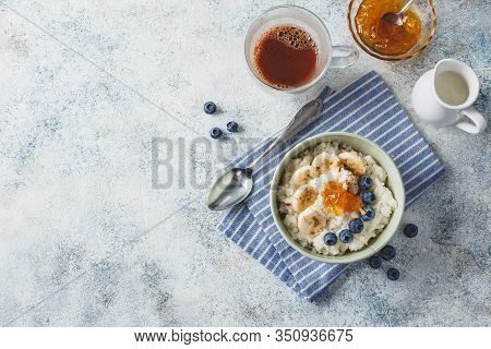 Breakfast With Milk Rice Porridge With Banans, Blueberry And Orange Jam, Creamy Rice Pudding Or Fren