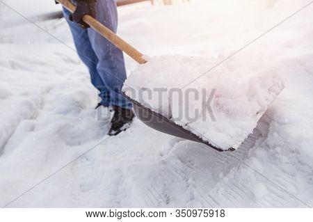 City Service Cleaning Snow Winter With Shovel After Snowstorm Yard Sunlight