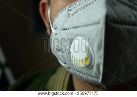 Wearing Mask To Protect Pm 2.5 Dust And Air Pollution. Close Up Of Thai Man Wearing Protection Mask 