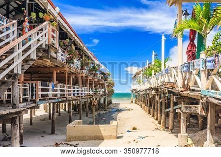 Hua Hin, Thailand - July 12th 2010: View Bewteen 2 Restaurants On Stilts To The Beach. The Area Is F