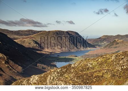 Epic Autumn Fall Landscape Of Buttermere And Crummock Water Surrounded By Mountain Peaks In Lake Dis