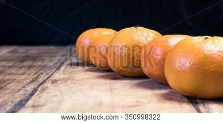 Tangerines (oranges, Mandarins, Clementines, Citrus Fruits) Over Rustic Wooden Background, Copy Spac