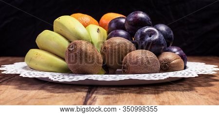 Fruit Basket - Fresh Kiwi Fruit, Bananas, Plums And Oranges
