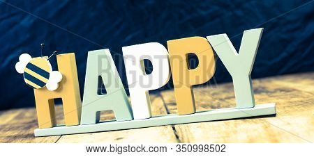 Be Happy Sign Isolated On Vintage Wooden Table