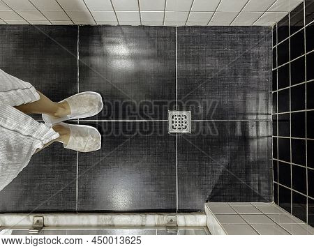 Floor Drain, Running Water In Shower, White And Black Tiles