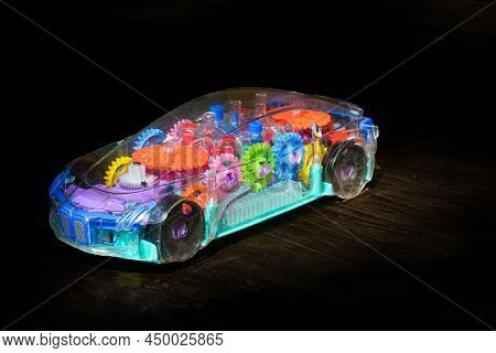 Transperent Mechanical Plastic Toy Model Of A Car With Black Background