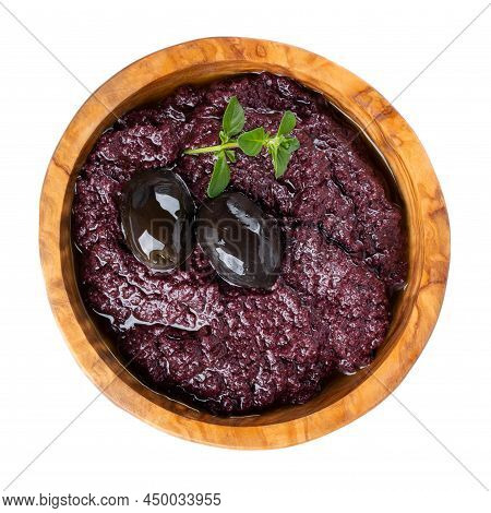 Tapenade - Olive Paste Made From Black Olives. Spreadable Black Olive Cream In Wooden Bowl Isolated 
