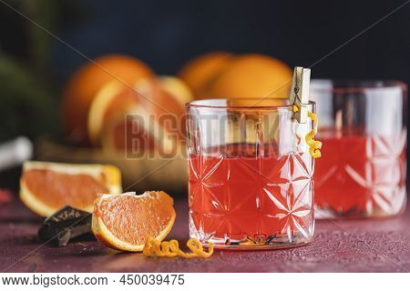 Two Glasses Of Chocolate Red Orange Negroni, An Italian Cocktail, An Aperitif, First Mixed In Firenz