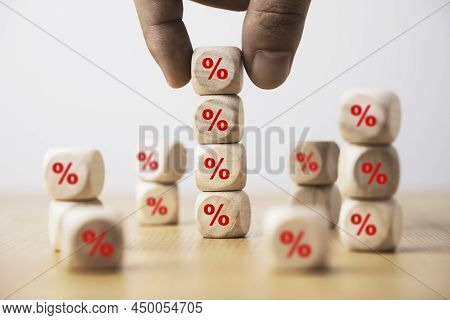 Hand Holding And Stacking Red Percentage Sign Print Screen On Wooden Cube Block For Interest Rate An