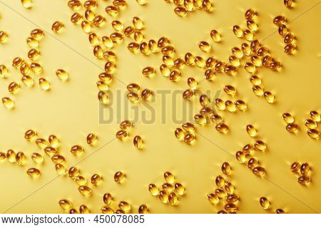 Capsules In A Shell With Liquid Vitamin D3 On A Yellow Background And A Place For Text