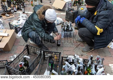 War In Ukraine. Kyiv Territorial Defense Making Molotov Cocktails