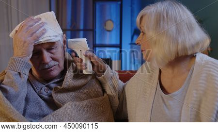 Senior Couple Grandfather And Grandmother Isolated At Home During Covid-19 Coronavirus Quarantine Lo