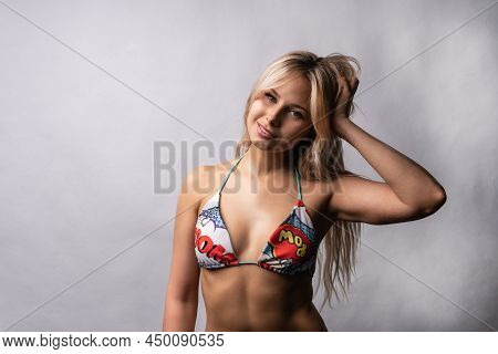 The Girl In The Swimsuit On The Black Background Is Beautiful Young Attractive Beautiful Pretty Neck