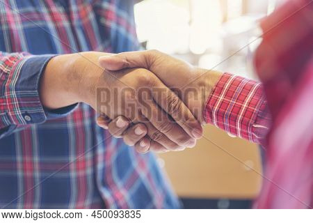Team Business Partners Shaking Hands Together To Greeting Start Up Small Business In Meeting Room. S