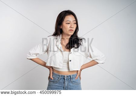 Sad Portrait Of Young Asian Woman Over Isolated Background