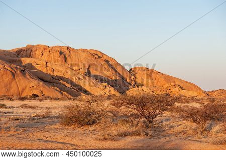 Impression Of The Rocky Namibian Desert Near Spitzkoppe During The Golden Hour Around Sunset.