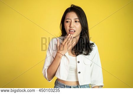 Sad Portrait Of Young Asian Woman Over Isolated Background