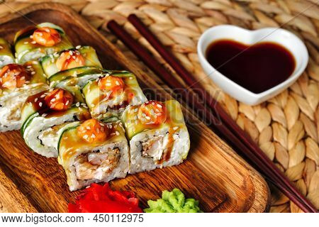 Japanese Rolls With Shrimp Wrapped In Cucumber With Sauce Sushi Close Up