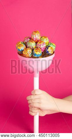 Bobruisk, Belarus 22.01.22: A Large Candy Brand Chupa Chups Consisting Of Small Candies On A Pink Ba