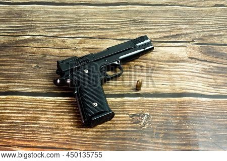 Black Smith&wesson Pistol And 9 Mm Bullet