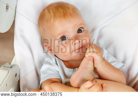 Cute Little Newborn Girl With Smiling Face Looking At Camera On White Background. Infant Baby Restin