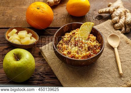 Masfouf From Couscous With Dried Fruits And Nuts Next To It On A Napkin, A Spoon On The Table, Fruit