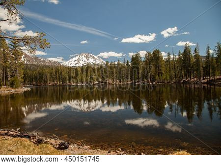Lassen Peak With Snow Viewed From Reflection Lake In Lassen Volcanic National Park, California