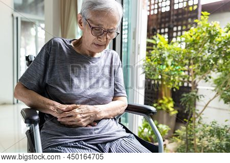 Asian Senior Woman With Abdominal Pain On Right Side Of Her Stomach,pain In Abdomen,irritable Bowel 