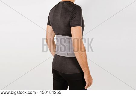 Lumbar Brace On The Human Body Isolated On A White Background. Trauma Of Back. Back Brace, Orthopedi