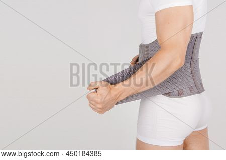 Lumbar Brace On The Human Body Isolated On A White Background. Trauma Of Back. Back Brace, Orthopedi