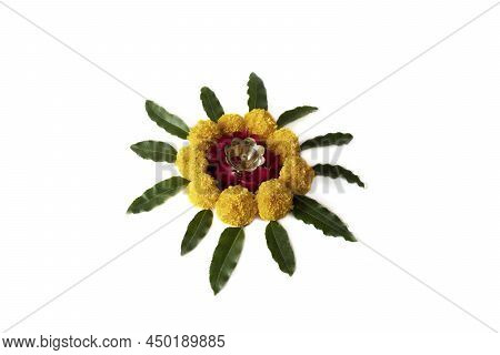 Flower Rangoli For Diwali Or Pongal Made Using Marigold Or Zendu Flowers And Red Rose Petals Over Wh