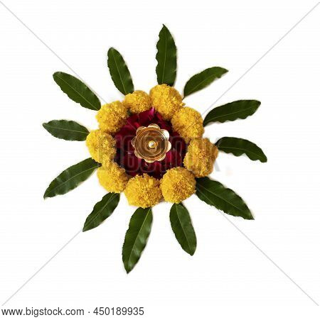 Flower Rangoli For Diwali Or Pongal Made Using Marigold Or Zendu Flowers And Red Rose Petals Over Wh