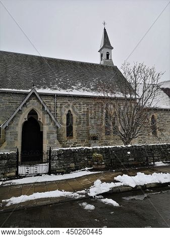 An Exterior View Of The Village Church Building During Winter In The Remote Highland Perthshire Vill
