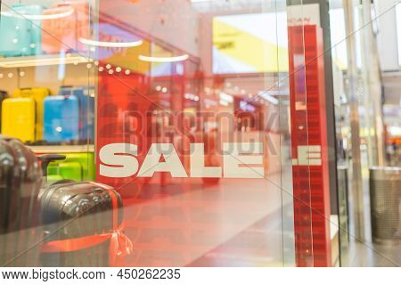 Sale White Word On Pink Fabrik Backdrop In Shop Window. Sspecial Offer, Big Sale Concept. Discounts 