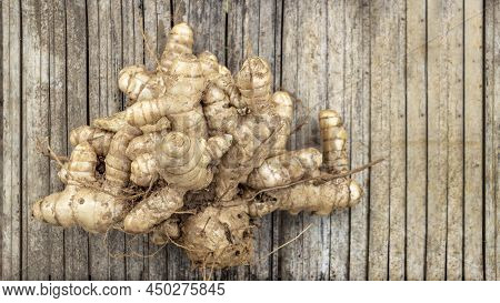 Harvest Ginger Root On Ratan Basket In Agriculture For Herb Ingredient In Thai Food