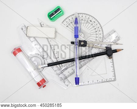 Geometrical Sketching Tools Like Protractor, Set Square, Ruler, Pen, Pencil, Sharpener, Compass And 