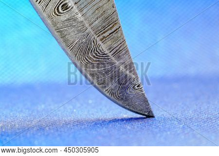 Hand-forged Knife Made Of Several Layers Of Steel With An Exclusive Pattern Photographed In The Stud
