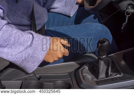 Hand Woman Driver Pulling The Hand Brake In Car
