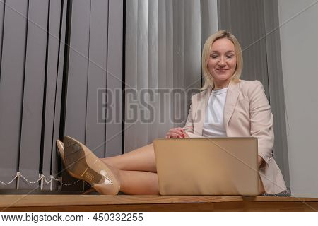 Girl Typing In A Laptop In A White Business Lady Suit, A Concept Independent Feminist Woman Laptop H