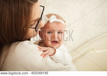 Child Screams, Colic, Stomach Aches, Mom Calms And Loves. Newborn, Teething, Pain And Discomfort. De