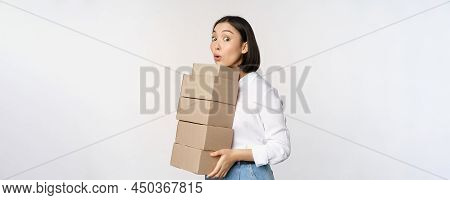 Portrait Of Young Asian Woman Holding Boxes, Carry Delivery Goods. Korean Female Entrepreneur Assemb